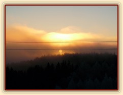 Východ slunce s mlhou